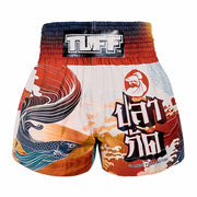 Colorful Muay Thai shorts with a prominent brand logo on a white background