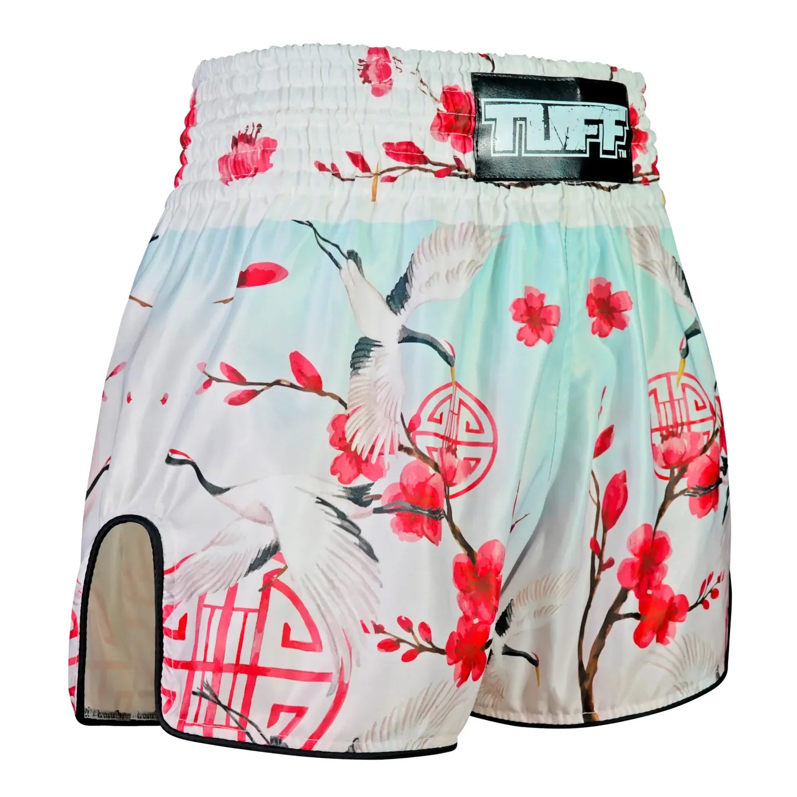 Traditional Japanese design Muay Thai shorts with cranes and cherry blossoms on a white background