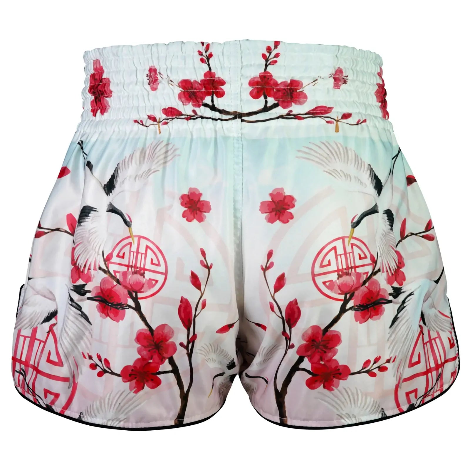 Muay Thai shorts with cherry blossom and crane design on a white background