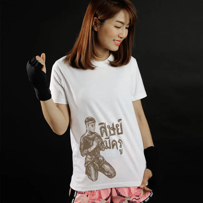 Woman wearing a white t-shirt with a graphic design on a black background