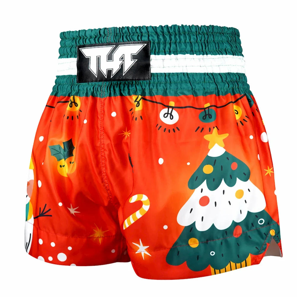 Colorful Christmas-themed Muay Thai boxer shorts with a brand label on a white background