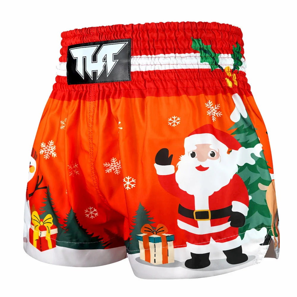 Red Muay Thai boxing shorts with Santa Claus design on a white background