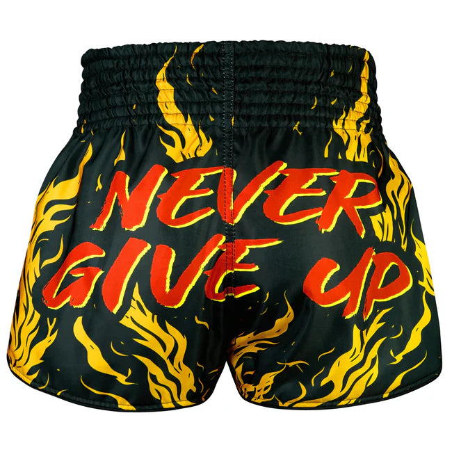 Black Muay Thai shorts with red and yellow 'Never Give Up' text and flame patterns on a white background