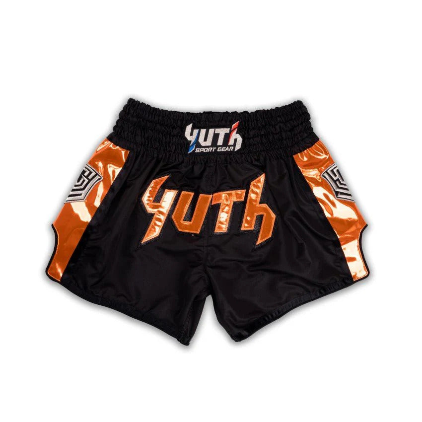 Black and orange Muay Thai shorts with 'YUTH' branding on a white background