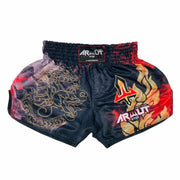 Pair of black Muay Thai shorts with dragon and flame designs on a white background