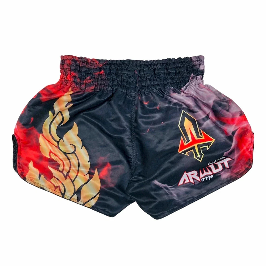 Black Muay Thai shorts with red and yellow flame design and brand logo on a white background