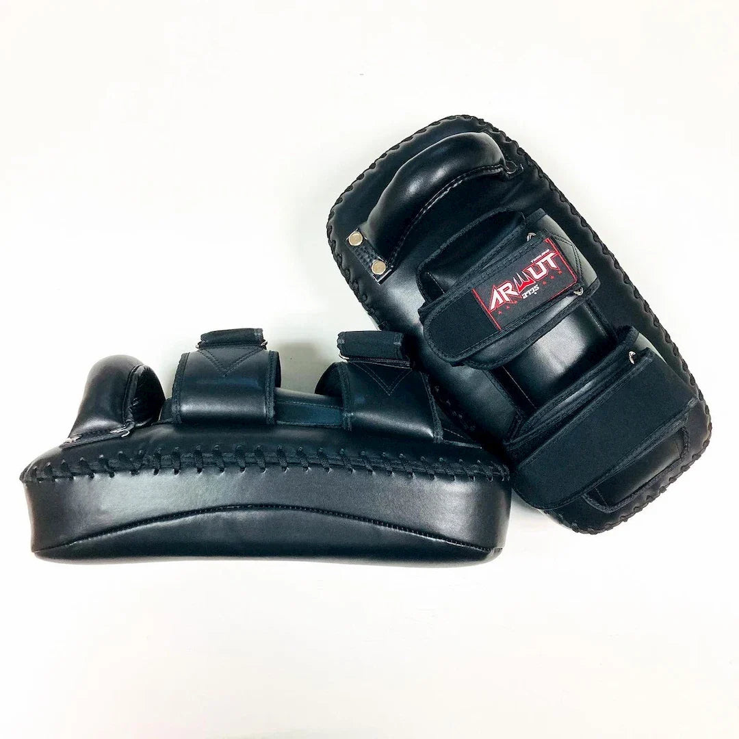 Pair of black martial arts Thai pads with a brand logo on a white background
