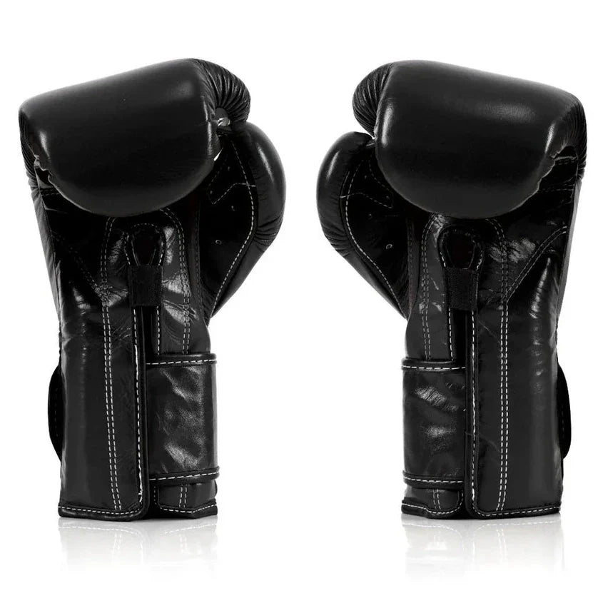 Pair of black boxing gloves on a white background