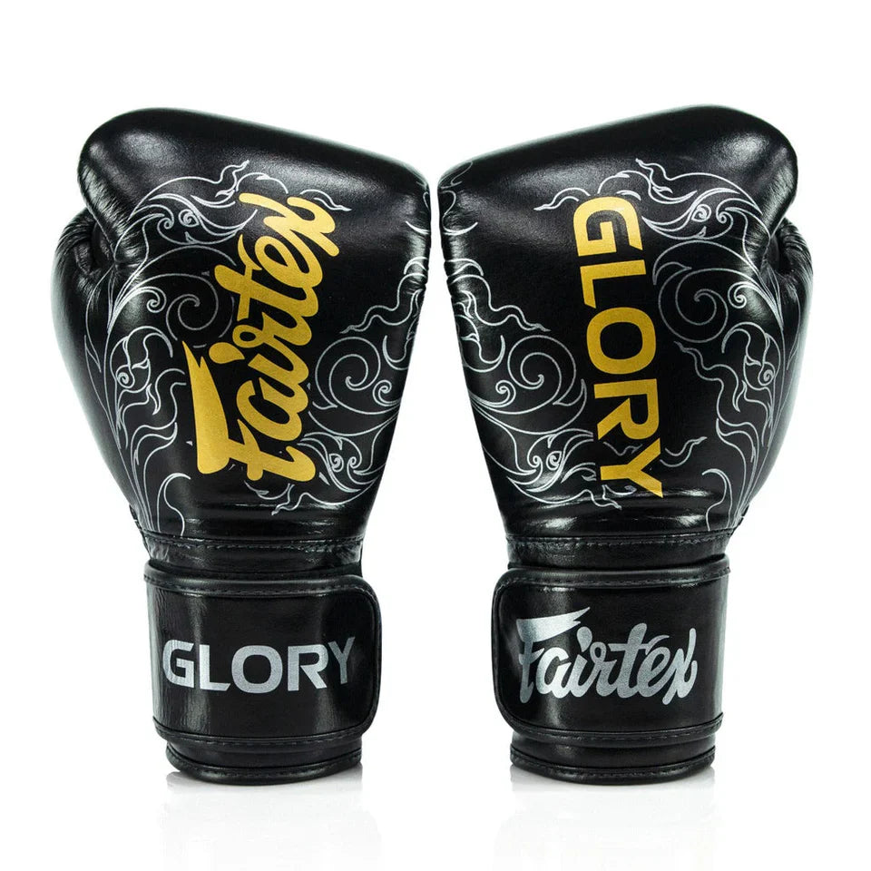 Pair of black boxing gloves with 'Fairtex' and 'Glory' branding on a white background