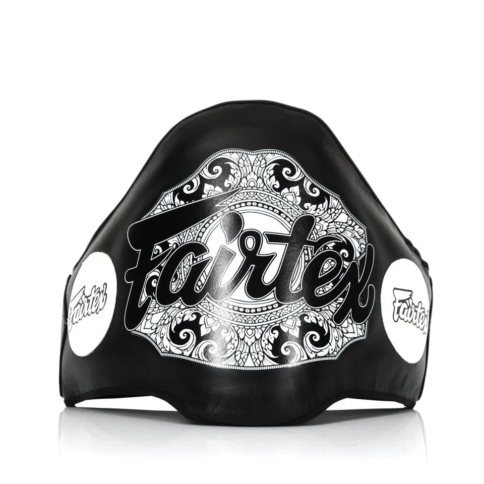 Black belly pad with white decorative patterns and 'Fairtex' branding on a white background
