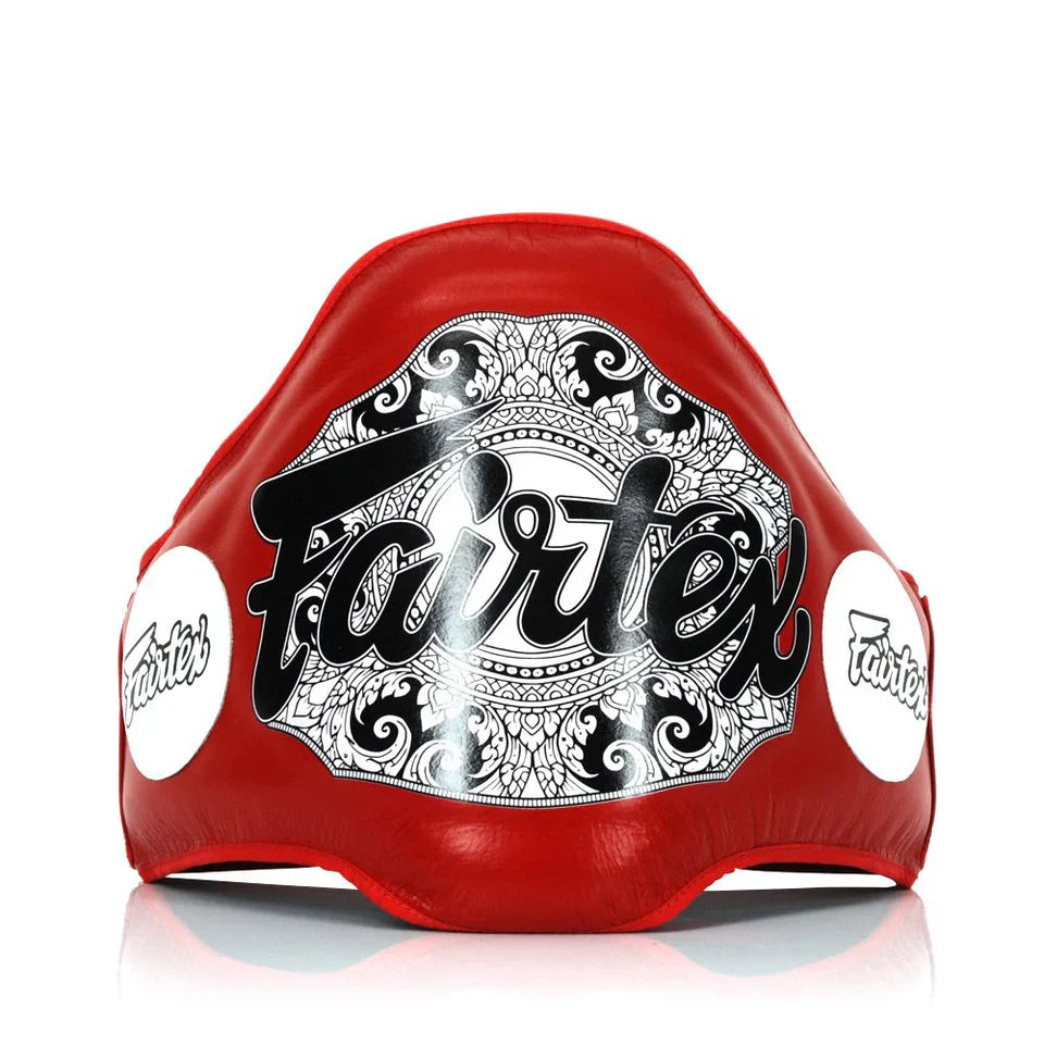 Red boxing belly pad with Fairtex logo on a white background