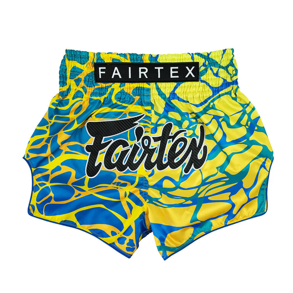 Blue and yellow patterned Fairtex shorts on a white background
