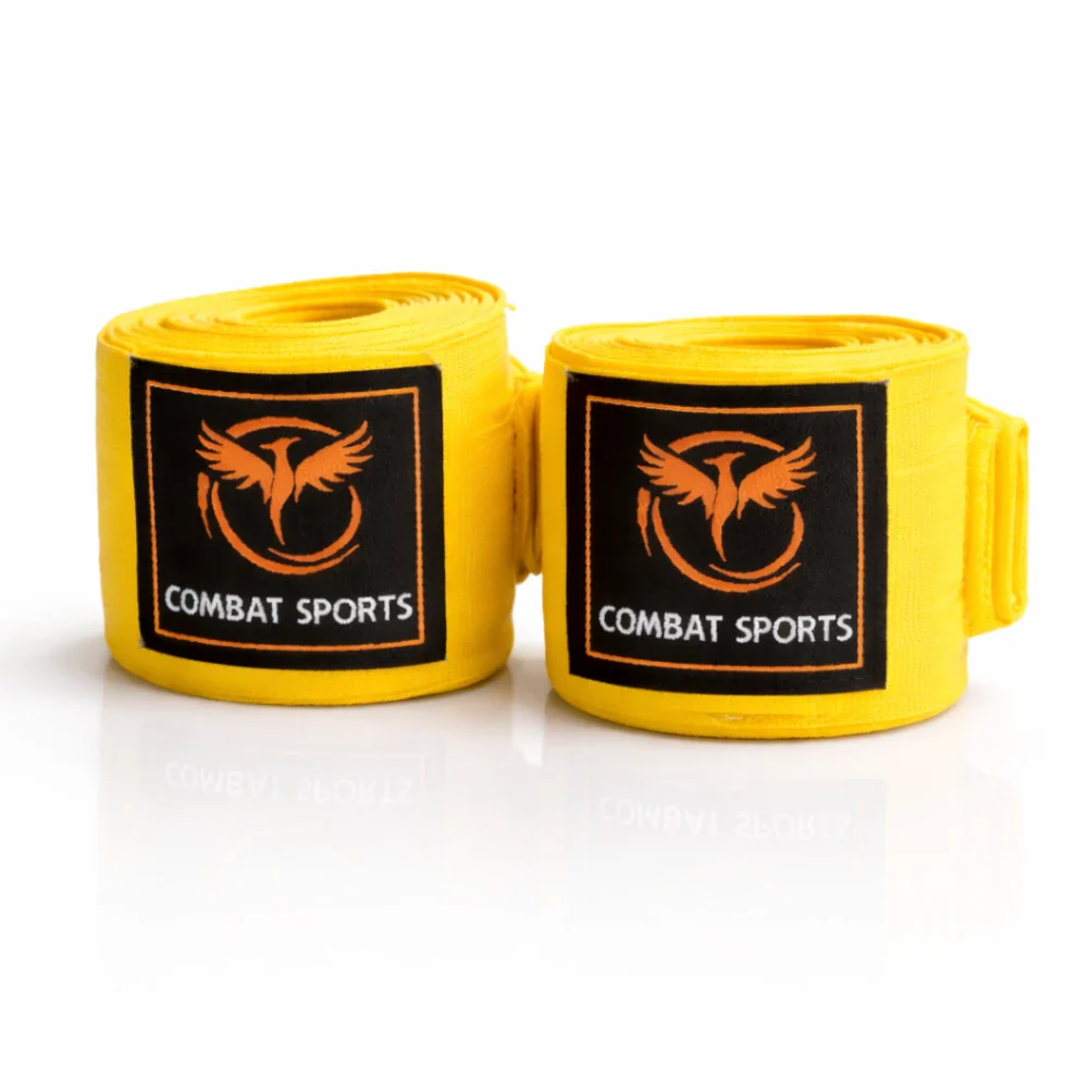 Two yellow boxing hand wraps with Combat Sports logo on a white background