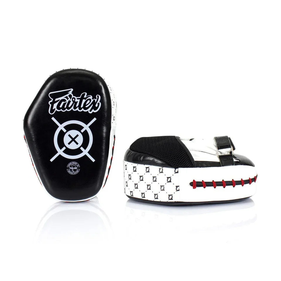 Black and white boxing mitts with Fairtex logo on a white background