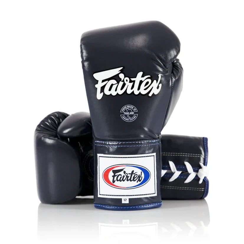 Navy blue boxing gloves with Fairtex logo on a white background