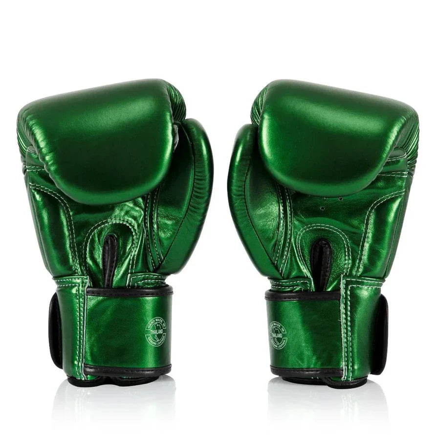 Pair of green boxing gloves on a white background