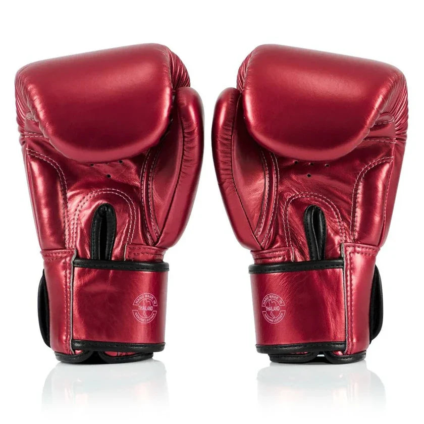 Pair of red boxing gloves on a white background