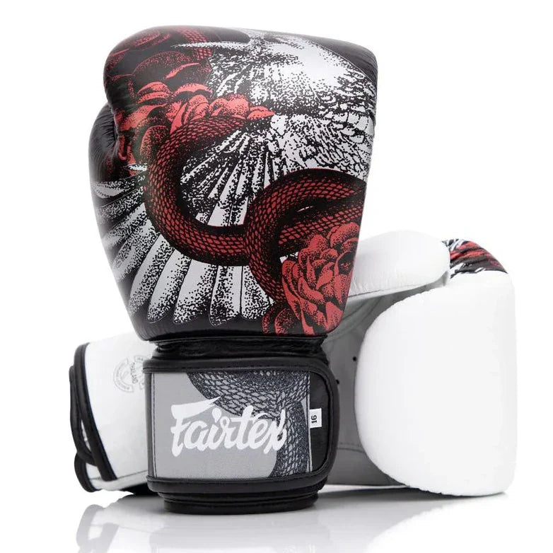 Boxing glove with snake design and 'Fairtex' branding on a white background