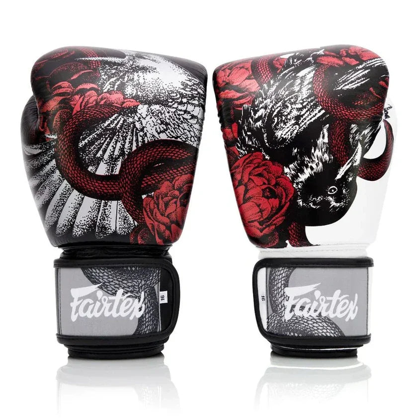 Pair of boxing gloves with snake and flower design on a white background, featuring the Fairtex brand.