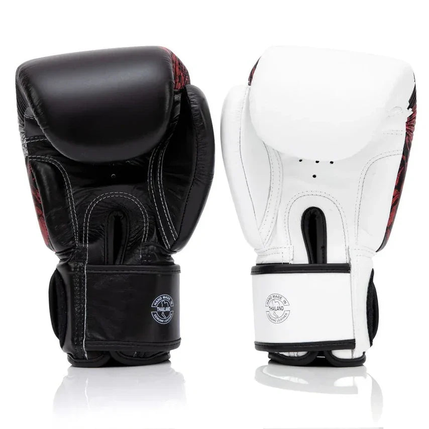 Black and white boxing gloves with brand logo on a white background