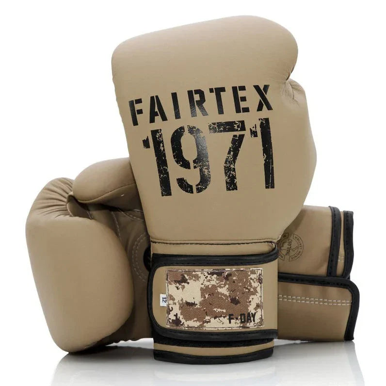 Pair of tan boxing gloves with 'Fairtex 1971' branding on a white background