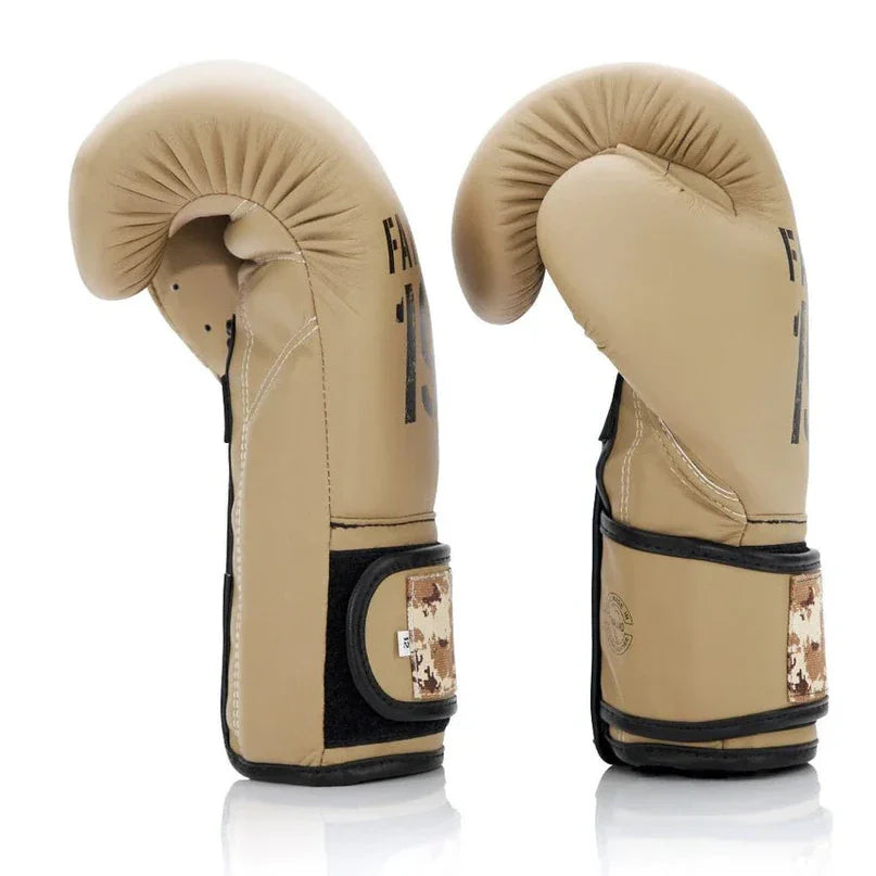 Pair of beige boxing gloves with black accents on a white background