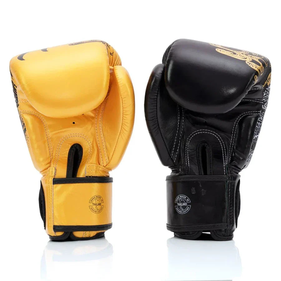 Pair of yellow and black boxing gloves on a white background