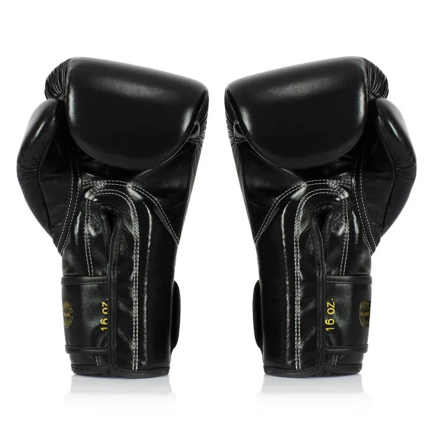 Pair of black boxing gloves with '16 oz' marking on a white background