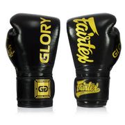 Black boxing gloves with yellow text on a white background