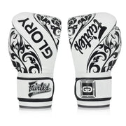 Pair of white boxing gloves with black patterns and Fairtex branding on a white background