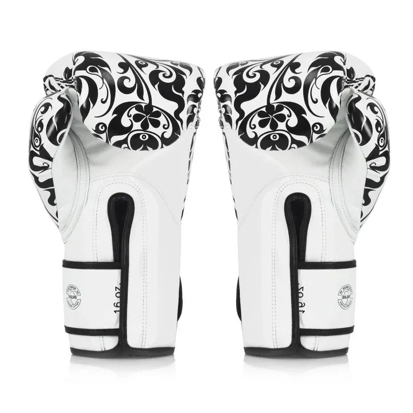 Pair of white boxing gloves with black patterns on a white background