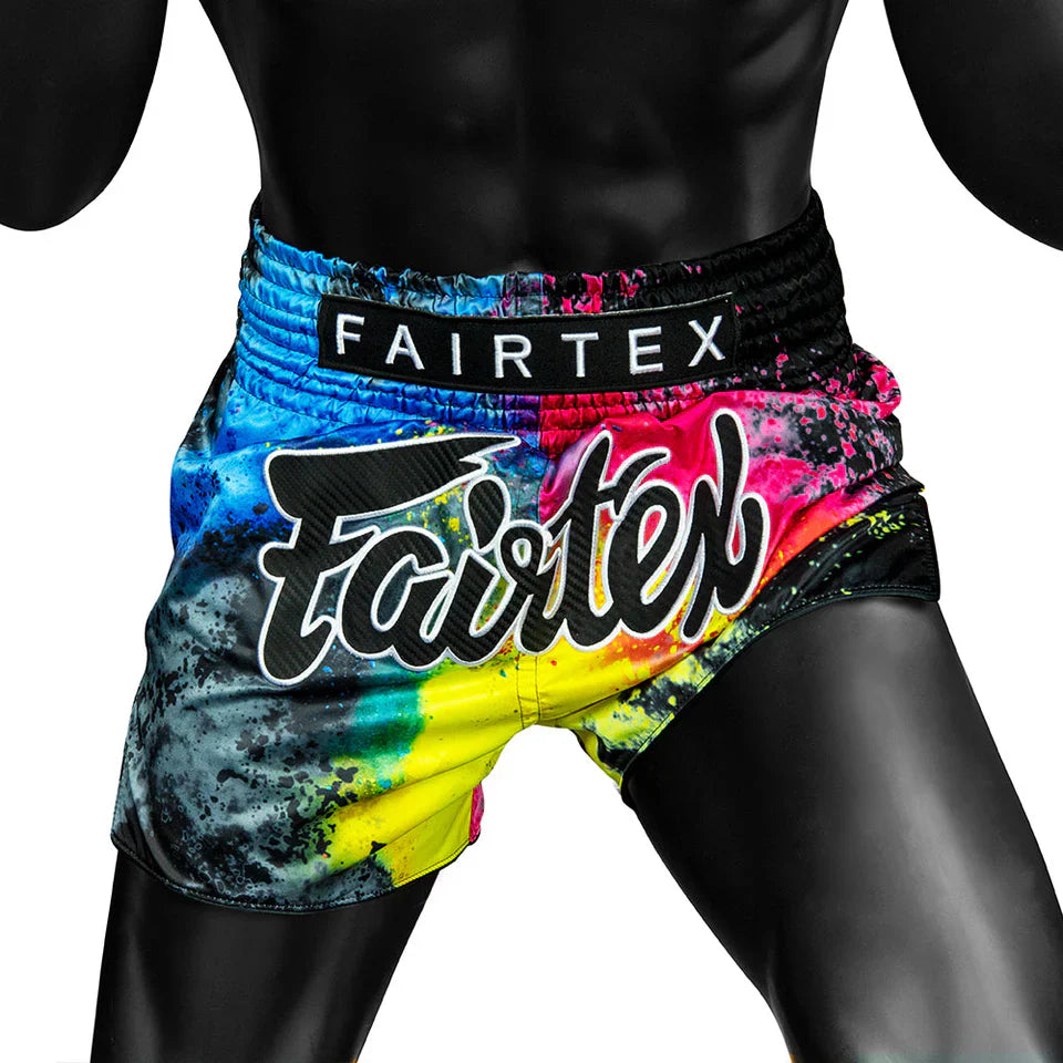 Colorful Fairtex boxing shorts with a black background