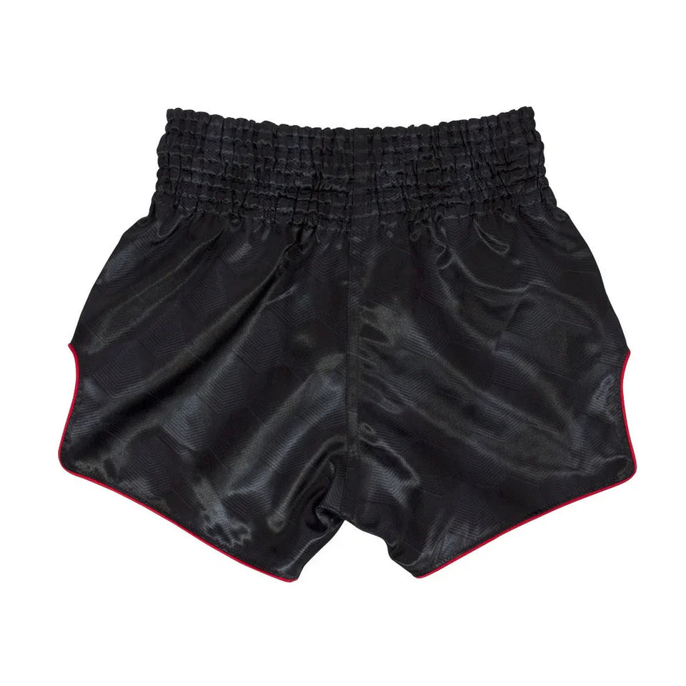 Black Muay Thai shorts with red trim on a white background