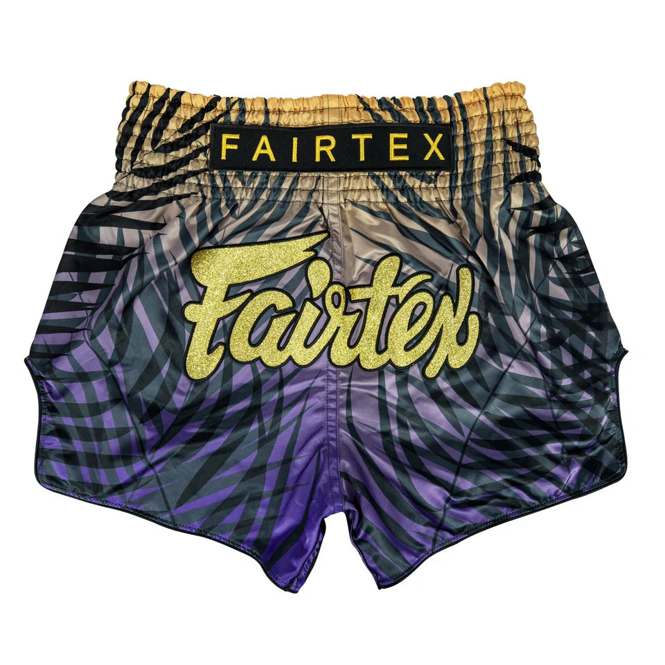 Fairtex boxing shorts with a purple and black pattern on a white background