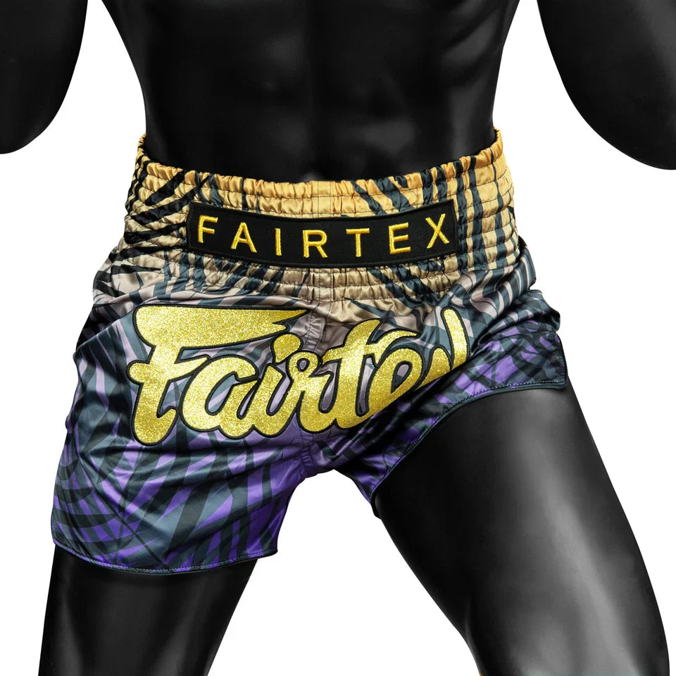 Fairtex boxing shorts with a colorful pattern on a white background