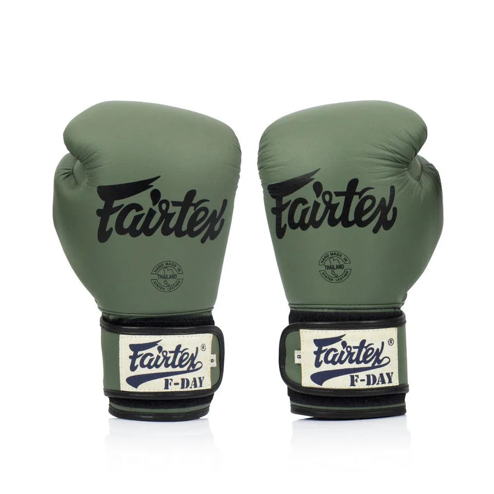 Pair of army green Fairtex boxing gloves on a white background