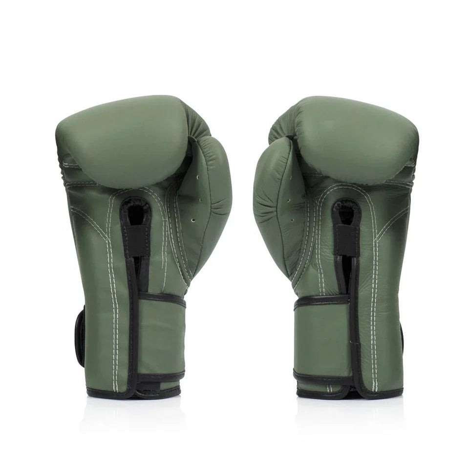 Pair of green boxing gloves on a white background