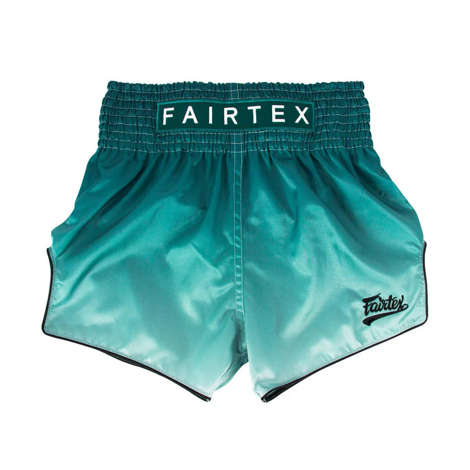 Teal Fairtex Muay Thai shorts on a white background
