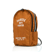 Brown backpack with 'Fairtex 1971 Fighter' text on a white background