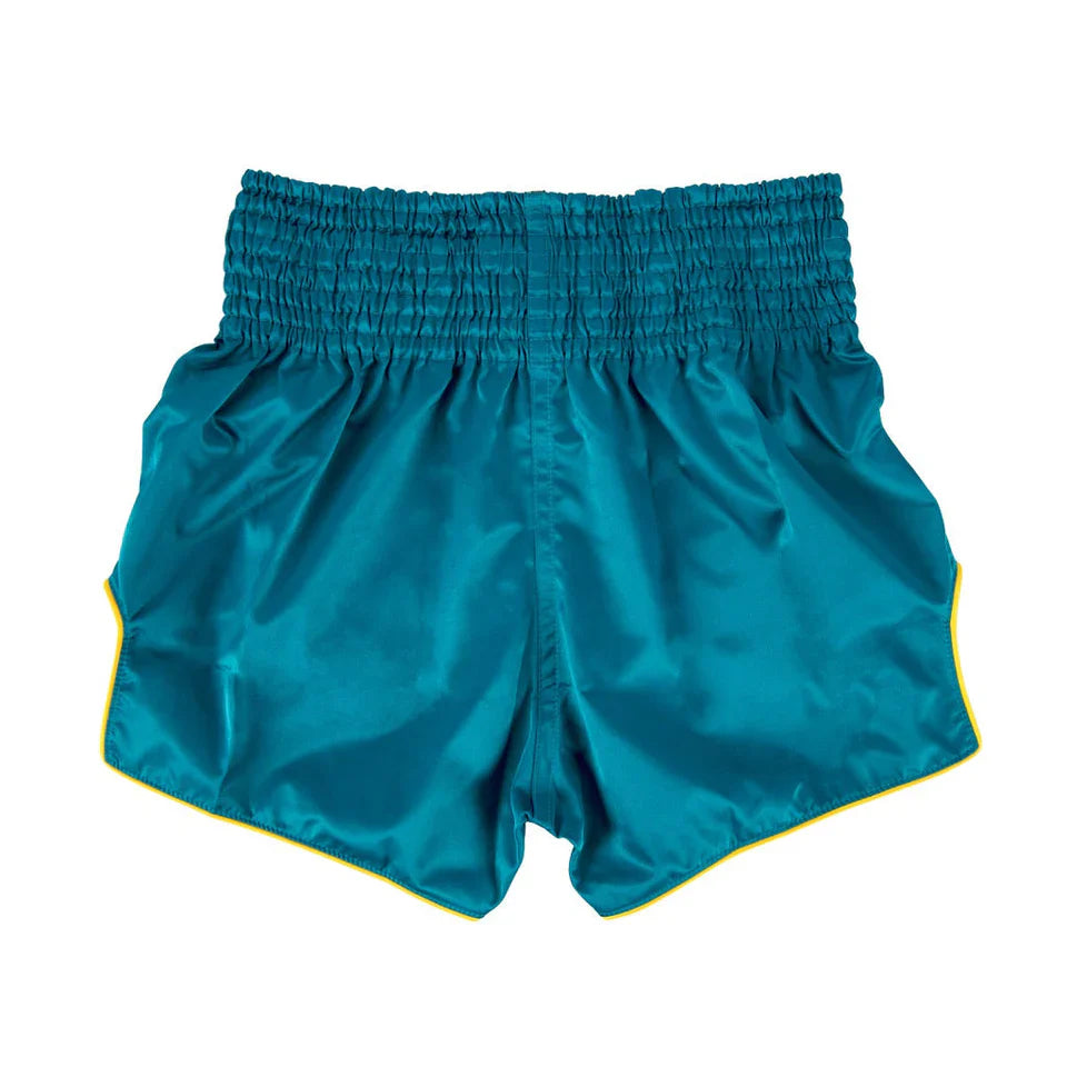 Teal Muay Thai shorts with a yellow trim on a white background