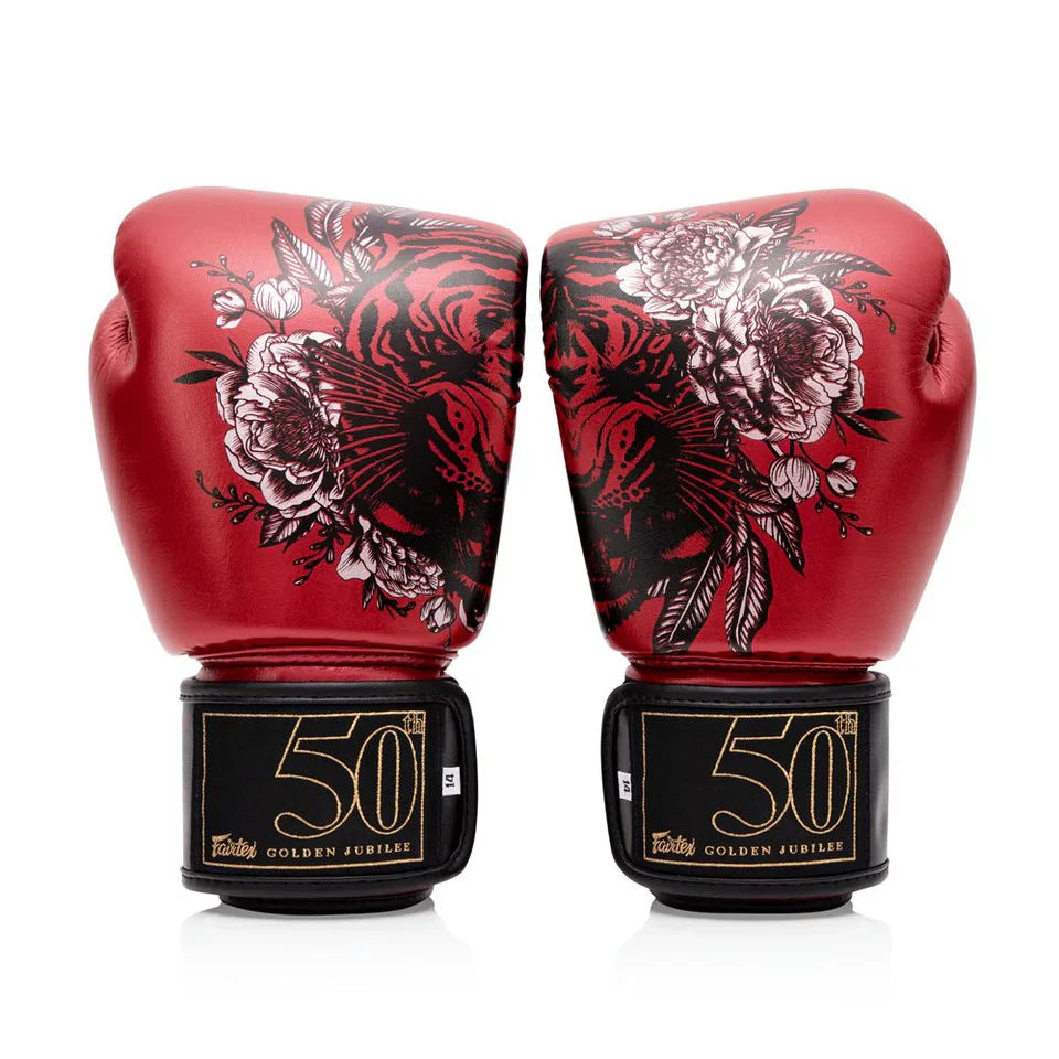 Red boxing gloves with floral designs and '50' branding on a white background