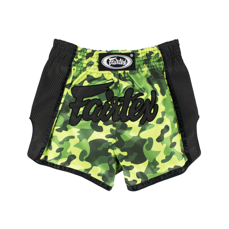 Green camouflage Muay Thai shorts with black accents and 'Fairtex' branding on a white background
