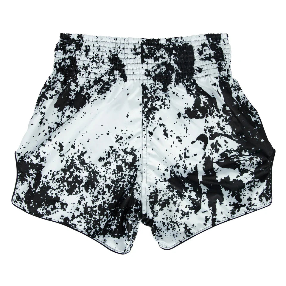 Black and white patterned Muay Thai shorts on a white background