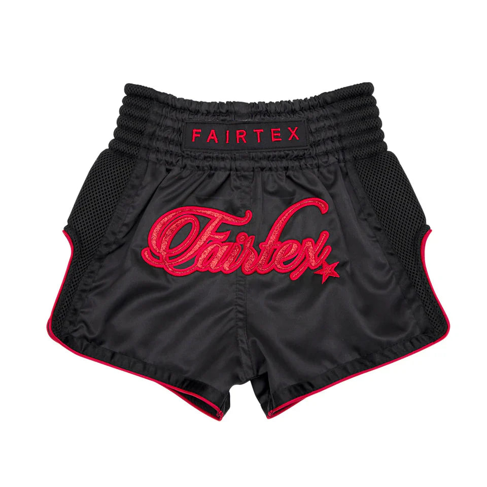 Black boxing shorts with red Fairtex logo on a white background