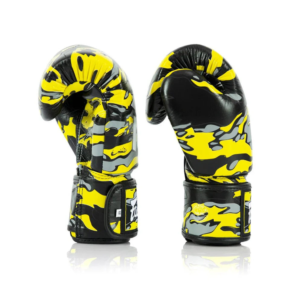 Black and yellow camouflage boxing gloves on a white background