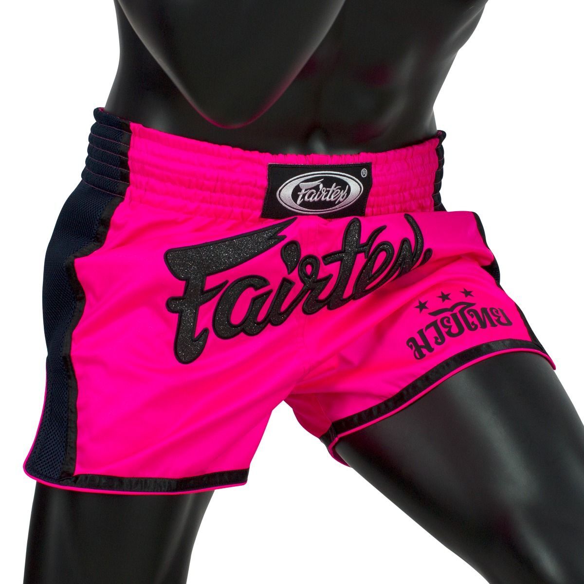 Pink and black Muay Thai shorts with 'Fairtex' branding on a white background