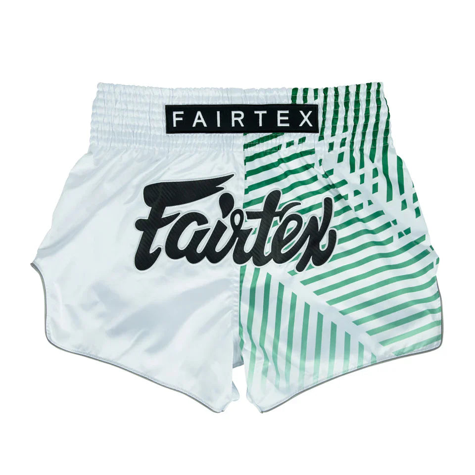 White and green Muay Thai shorts with Fairtex branding on a white background