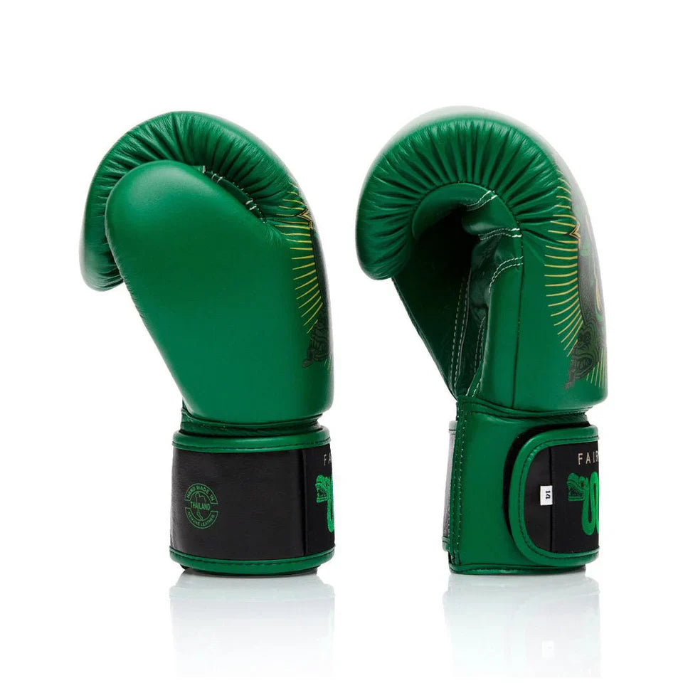 Pair of green boxing gloves with black accents on a white background