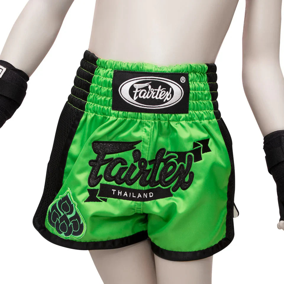 Green Fairtex boxing shorts with black trim on a white background