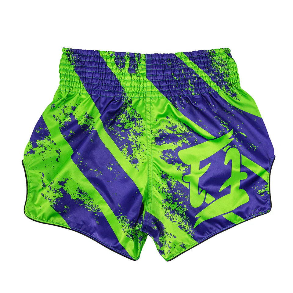 Green and purple Muay Thai shorts with a design on a white background